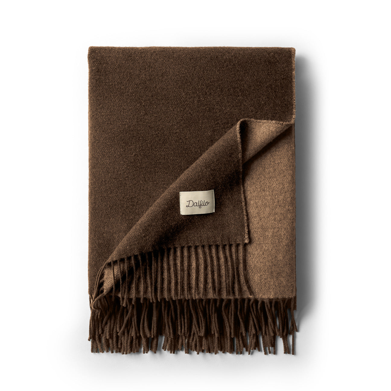 Manta doble cara de lana y cashmere
- 130×180 cm- Nogal- Lana reciclada + cashmere - Dalfilo